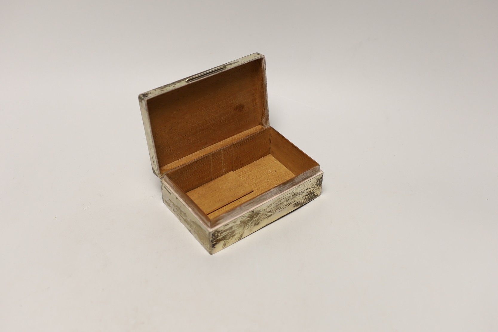 A George V silver mounted rectangular cigarette box, Charles & Richard Comyns, London, 1924, 14cm.